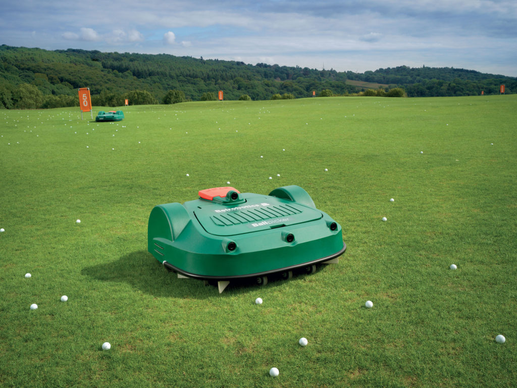 Ballpicker in action collecting golf balls